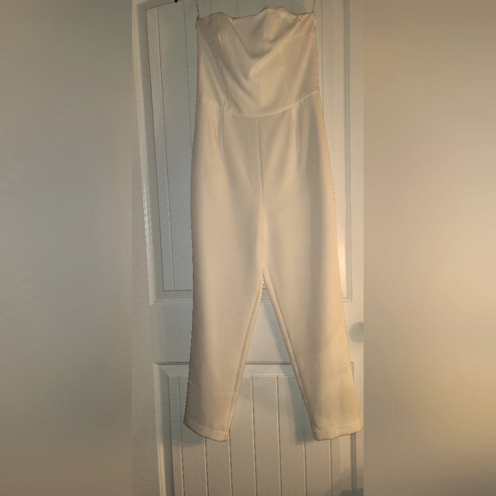 Express ivory color jumpsuit size 6 with zipper in the back.